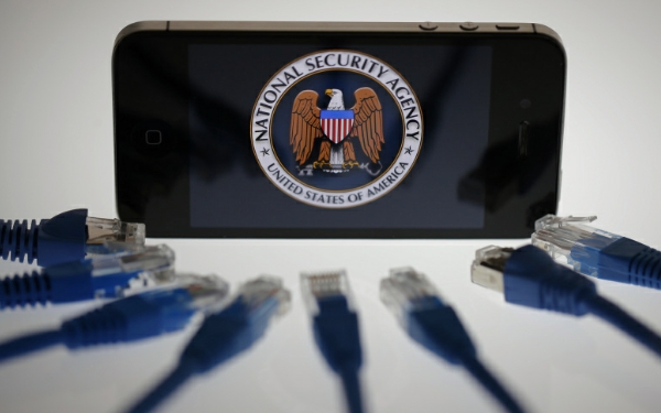 An illustration picture shows the logo of the U.S. National Security Agency on the display of an iPhone in Berlin