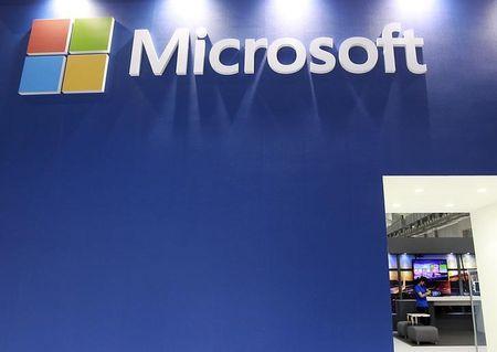 A employee stands in the Microsoft booth during the 2014 Computex exhibition at the TWTC Nangang exhibition hall in Taipei